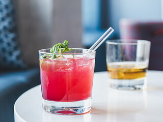 Beautiful glass with a refresh cocktail, standing on a table. Top view, close-up. Vacation and travel concept. Moments of celebration