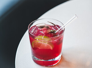 Beautiful glass with a refresh cocktail, standing on a table. Top view, close-up. Vacation and travel concept. Moments of celebration