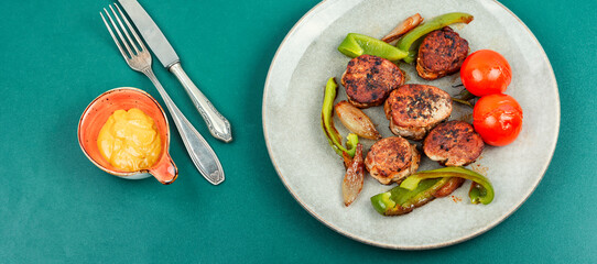 Appetizing pork medallions.