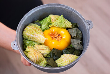 Moldovan cabbage rolls and sweet, yellow paper with rice and chicken meat