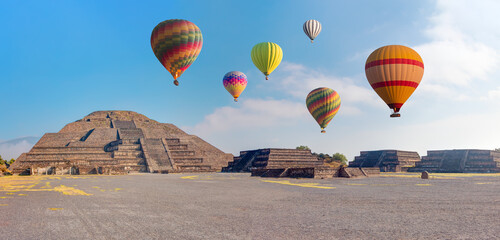 Hot air balloon flying over Teotihuacan pyramids complex located in Mexican Highlands and Mexico...