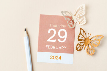 February 29th mini calendar for February 2024 and butterfly paper. Leap year, intercalary day, bissextile. - obrazy, fototapety, plakaty