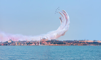 Air Force aerobatic team performing demonstration flight over Famous historical peninsula of...