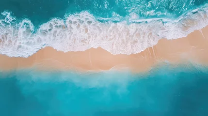 Türaufkleber Sand beach from above with light blue water wave and sun lights © Ilmi