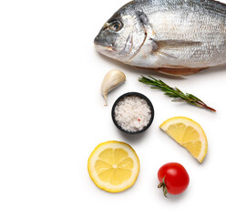 Raw dorado fish with ingredients on white background