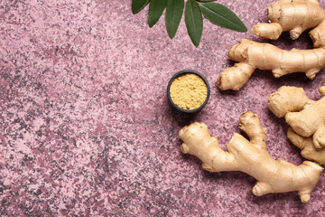 Fresh ginger roots with leaves and bowl of dried powder on purple background