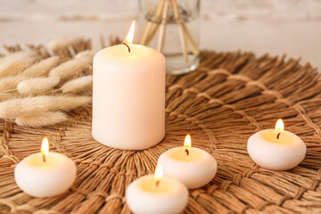 Wax burning candles on table