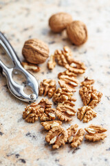 Peeled dried walnut kernels on kitchen table.