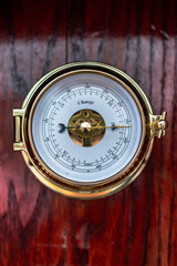 Nautical Elegance: Vintage Thermometer on a Ship