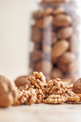 Peeled dried walnut kernels on kitchen table.