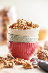 Peeled dried walnut kernels in bowl.