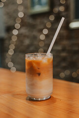 iced latte caramel in a beautiful glass mug in a coffee shop