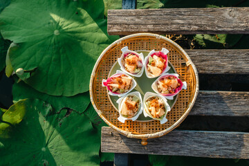 Miang Kham lotus petals-wrapped is a food that people is eaten as a snack. Lotus lotus petals are a...