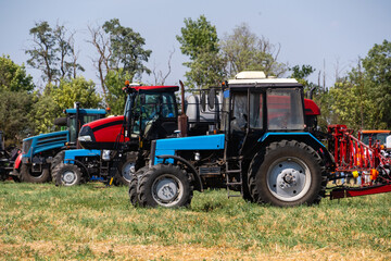 Agricultural tractors on a field