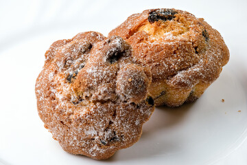 Two sweet cupcakes with raisins