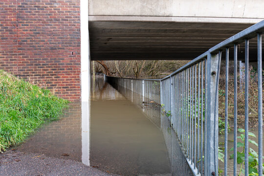 flooded footpath in watford UK. where the River colne has burst it banks