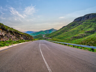 Fototapeta premium A3 highway through a gorge surrounded by mountains in the highlands of Lesotho