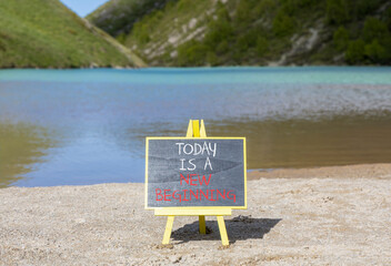 Today is a new beginning symbol. Concept words Today is a new beginning on beautiful blackboard....