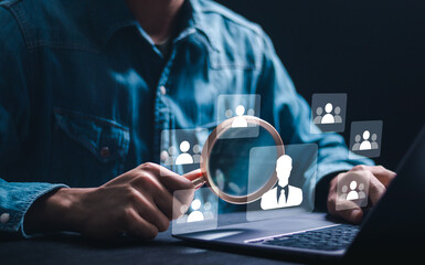 HR manager use magnifying glass focus to virtual Human resource icons for employee recruitment. Human resource management (HR), Check resume, Screening employee information and job applicants.