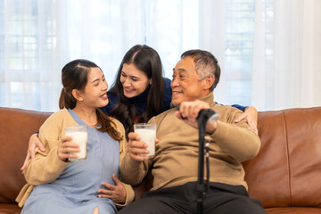 Obraz premium Portrait of enjoy happy love asian family senior mature father and young daughter smiling play laughing and having fun together at home, care, elderly, insurance.happy family and Father Day concept