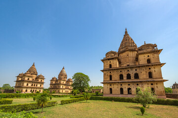 Fototapeta premium Orchha, India - 02 June 2022 - Royal Chhatris or Cenotaphs are the historical monuments situated on the banks of River Betwa in Orchha, Madhya Pradesh, India.