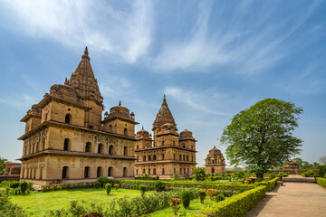 Fototapeta na wymiar Orchha, India - 02 June 2022 - Royal Chhatris or Cenotaphs are the historical monuments situated on the banks of River Betwa in Orchha, Madhya Pradesh, India.