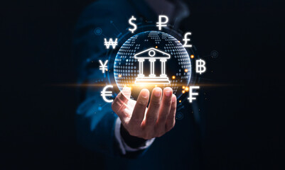 Online banking interbank payment. Businessman holding virtual global online banking icon for money transfers and currency exchanges between countries of the world, central bank and foreign currency.