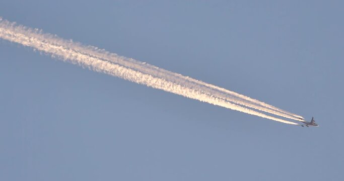 airplane and contrail in the sky