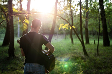 Guitar player in the forest