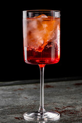 alcohol cocktail in a glass stands on a table in a bar or restaurant