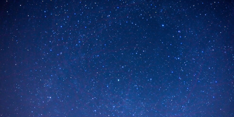 Starry night in dark blue sky background