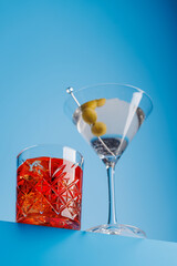 Cocktail delight: Vibrant drinks against a cool blue background