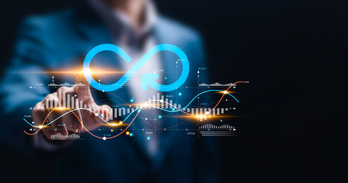 Business planning and strategy concept. Businessman touching with virtual infinity symbol and business profit revenue growth graph for Circular economy with infinite concept.