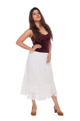 Young Indian girl wearing red velvet top and white crochet skirt with elegant pose and expression