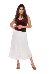 Young Indian girl wearing red velvet top and white crochet skirt with elegant pose and expression