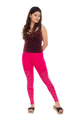 Fototapeta premium Young Indian girl wearing red velvet top and pink leg ins with elegant pose and expression