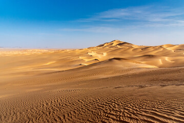 Landscape of Erg Admer in the Sahara desert, Algeria. A view of the dunes and ripples dug by the wind in the sand.