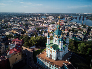 Aerial top view of Saint Andrew's church and Andreevska street from above, cityscape of Podol...