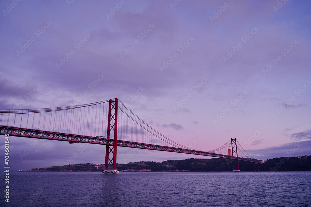 Sticker Beautiful landscape with suspension 25 April bridge bridge over the Tagus river in Lisbon, Portugal.