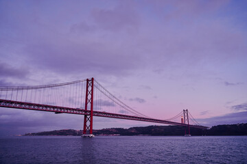 Fototapeta na wymiar Beautiful landscape with suspension 25 April bridge bridge over the Tagus river in Lisbon, Portugal.