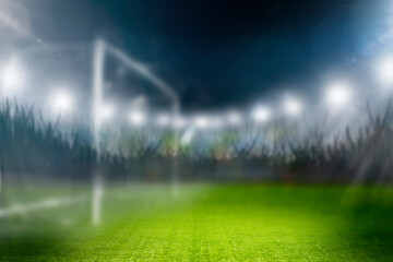 Fussball im Scheinwerferlicht in einem Fussballstadion - obrazy, fototapety, plakaty