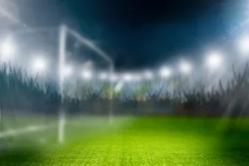 Foto op Plexiglas Fussball im Scheinwerferlicht in einem Fussballstadion © by-studio