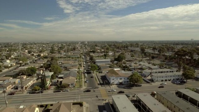 Aerial Forward Tilt Down Shot Of Residential Roofed Houses In City On Sunny Day - Los Angeles, California