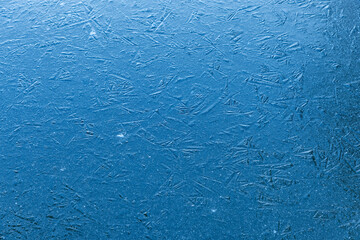 Beautiful frozen ice pond aerial view across snowy park landscape