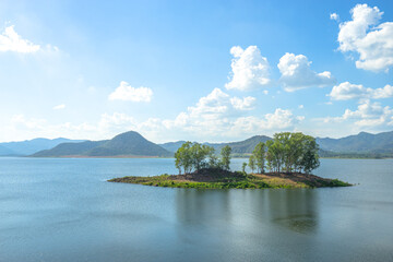 Beautiful scenic of water dam with the trees island at dam in Thailand.