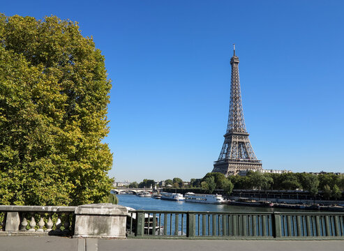 view of the Eiffel tower walking through Paris