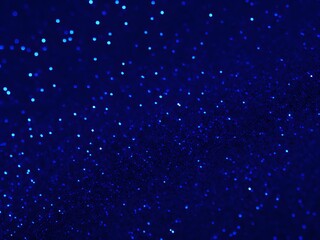 Gorgeous abstract backdrop featuring blue glitter and defocused lights