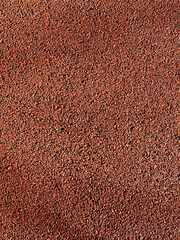red rubber coating rubber for the road with shadows. protective red coating of crumb rubber....