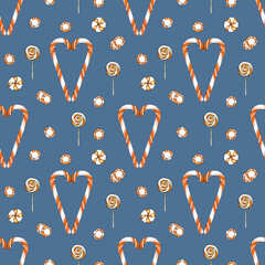 Christmas seamless pattern with candy canes on blue background