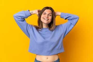 Young Slovak woman isolated on yellow background laughing